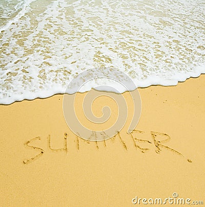 Summer written in a sandy tropical beach Stock Photo