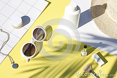 Summer yellow cosmetics flat lay with sunglasses . Top view Stock Photo