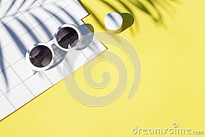 Summer yellow cosmetics flat lay with sunglasses . Top view Stock Photo