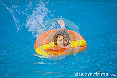 Summertime fun. Little kid swimming in pool. Kid in swimming pool relax and swim on inflatable ring. Summer vacation Stock Photo