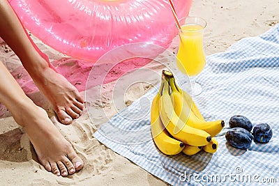 Summertime leisure. Fruits cocktails beach and fun after joyful swimming Stock Photo