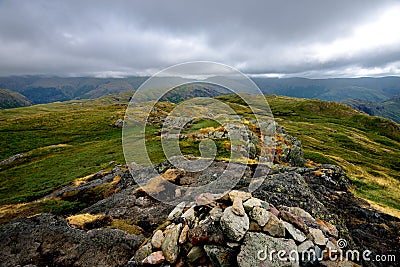 Dark storm clouds over the Helvellyn mountain range Stock Photo