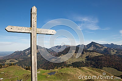 Summit Cross in Front of Panorama of European Alps Stock Photo