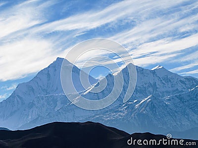 The summit of Dhaulagiri over the village of Muktinath Stock Photo