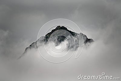 Summit of a mountain in the clouds Stock Photo