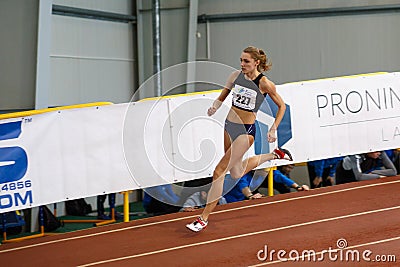 SUMY, UKRAINE - FEBRUARY 17, 2017: Anna Drozdova compete in the women`s 400m running in an indoor track and field event. Editorial Stock Photo