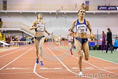 SUMY, UKRAINE - FEBRUARY 21, 2020: champion Nataliya Strebkova at the finish of 3000m race at Ukrainian indoor track and Editorial Stock Photo