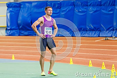 SUMY, UKRAINE - JANUARY 28, 2018: Vitaliy Butrym after win in 400m race on Ukrainian indoor track and field team Editorial Stock Photo