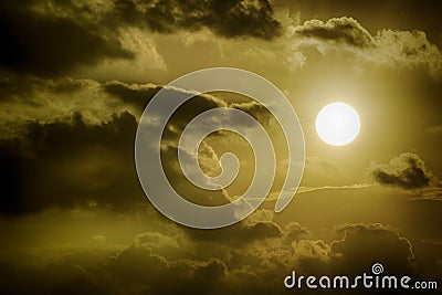 Sun amidst dark clouds Stock Photo