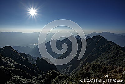 Sun beam over top mountain view of fansipan highest mountain in northern vietnam Stock Photo