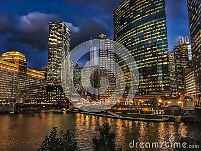 Chicago River reflections of sunset and buildings as sun sets Stock Photo
