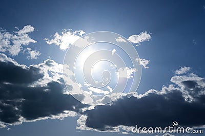 Sun behind the clouds Stock Photo