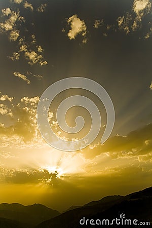 Sun behind clouds Stock Photo