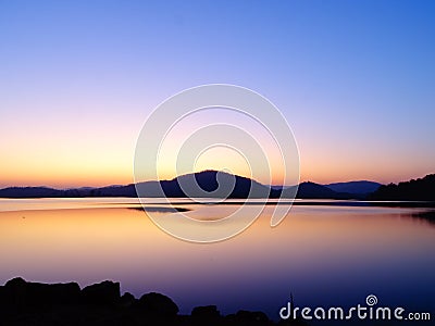 The Sun below the horizon, Twilight landscape of Rani Rashmi Devi Singh Reservoir, Chhattishgarh, India. Stock Photo