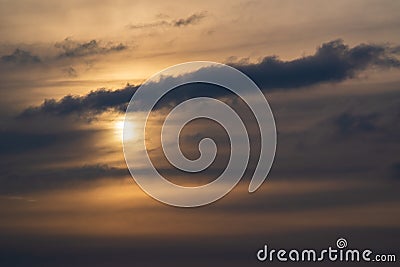 Sun Burst rays break over the clouds shining sunset Beautiful evening Sunbeams dark rain Stock Photo