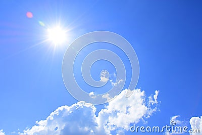 Sun and clouds with blue sky texture. Stock Photo