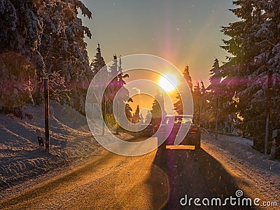 Sun dazzles motorists in the Winter landscape Stock Photo