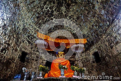 sun-drenched buddha image in ancient Htukkhanthein temple, Mrauk U, Rakhine State, Myanmar Stock Photo