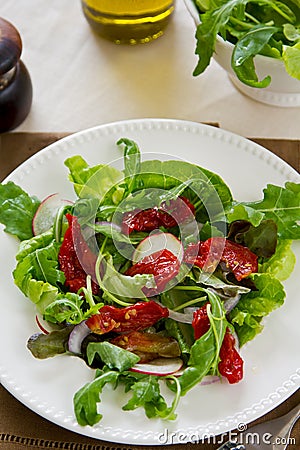 Sun-dried tomato with arugula salad Stock Photo