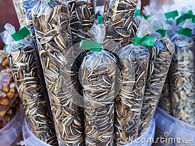 Sun flower seeds in plastic bags Stock Photo