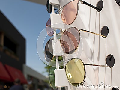 Sun glasses on the counter. three pairs of sunglasses in different colors Stock Photo