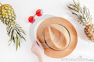Sun glasses, hat, pineapple in exotic summer fruit design on white background top view mock-up Stock Photo