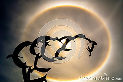 Sun halo and bird statue. Stock Photo