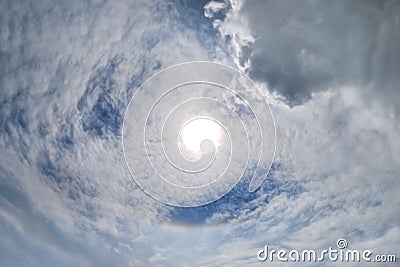 Sun Halo. Rainbow in the Skies. Spiral Clouds. Stock Photo