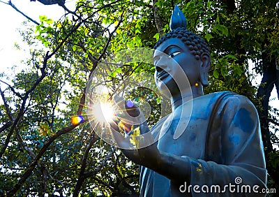 Sun in the hands of the Buddha statue in Buddhism. Editorial Stock Photo