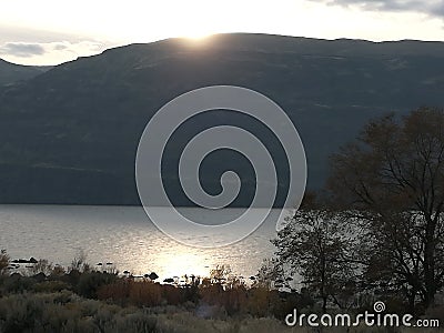 Sun, hill lake tree sky Stock Photo