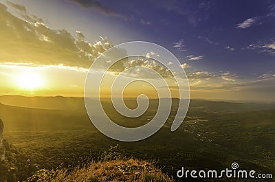 Sun illuminating the bright rays of the crowns of trees at t Stock Photo