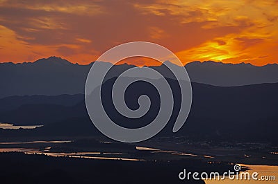 Sunset Behind Mountains in SE Alaska Stock Photo