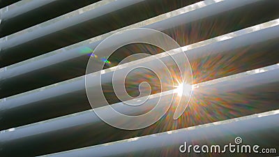 Sun lens flare through window louvers Stock Photo