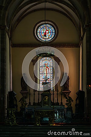 Sun light through the leaded pane in old majestic church Stock Photo