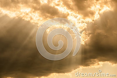 Sun light rays coming through the cloud Stock Photo