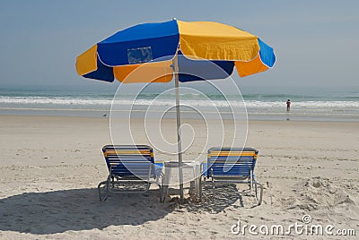 Sun loungers on beach Stock Photo