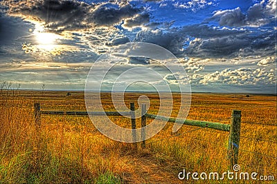 Sun lowering in the late afternoon skies over the midwestern plains HDR Stock Photo