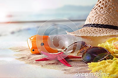 Sun protection articles on table in terrace overlooking beach Stock Photo