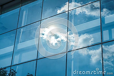 Sun ray and blue sky reflection on window office building, Business concept Stock Photo