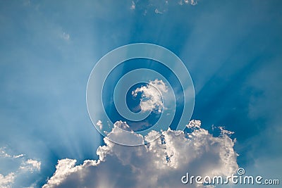 Sun Rays, Blue Fluffy Clouds Stock Photo