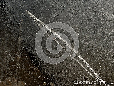 Sun rays caught in cracks in ice piece. Broken floe Stock Photo