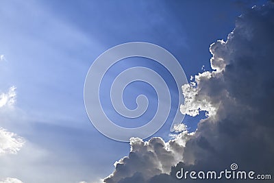 Sun rays through a cloud Stock Photo