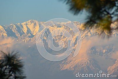 Sun rays mountain landscapeA beautiful landscape view with sun beams through clouds from the top of a mountain. Stock Photo