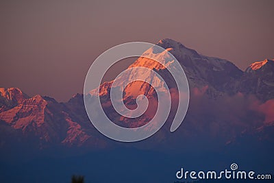 Sun rays mountain landscapeA beautiful landscape view with sunset golden hour through clouds from the top of a mountain. Stock Photo