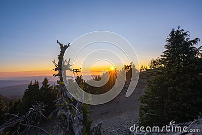 Sun rays over Crater Lake National Park at Sunset Stock Photo