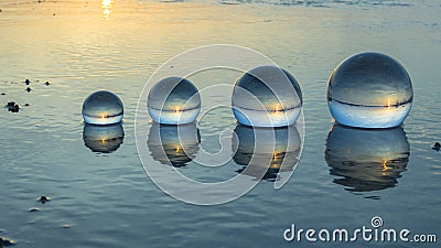 Time lapse crystal ball placed on the beach Stock Photo