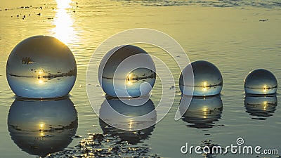 Time lapse crystal ball placed on the beach Stock Photo