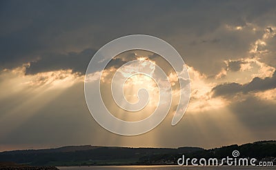 Sun's rays over Black Isle and Beauly Firth. Stock Photo