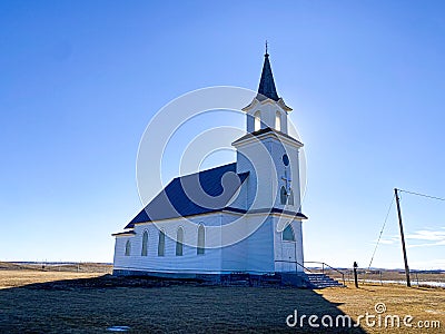 the sun sets on this longstanding historic old country church Stock Photo