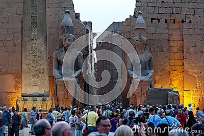 The sun sets over the entrance pylon of the Luxor Temple (Temple of Amun-Ra) in Luxor, Egypt. Editorial Stock Photo